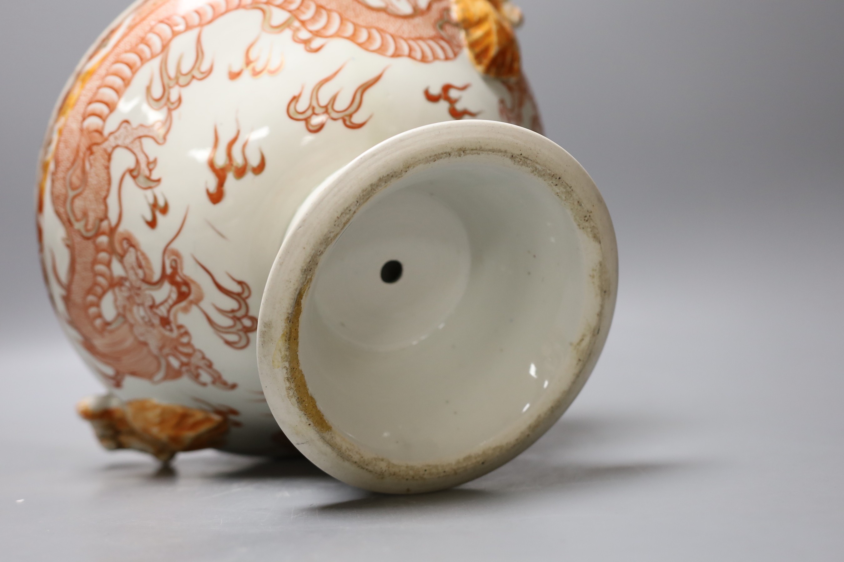 A Japanese red and white pedestal bowl, 19cm high, and a dragon pattern dish (2)